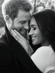 In this photo released by Kensington Palace on Thursday, Dec. 21, 2017, Britain's Prince Harry and Meghan Markle pose for one of two official engagement photos, at Frogmore House, in Windsor, England. (Alexi Lubomirski via AP)