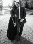In this photo released by Kensington Palace on Thursday, Dec. 21, 2017, Britain's Prince Harry and Meghan Markle pose an official engagement photo, at Frogmore House, in Windsor, England. (Alexi Lubomirski via AP)